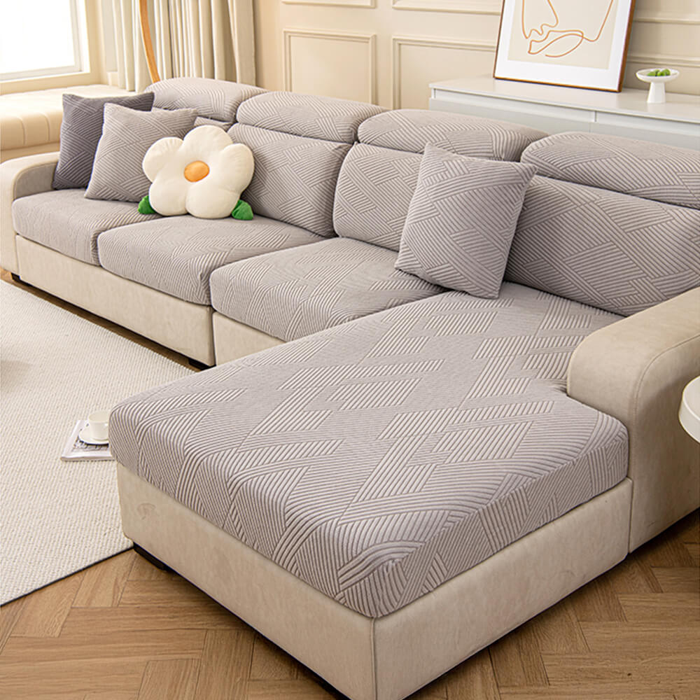 Housse de canapé magique stretch pleine largeur motif géométrique moderne