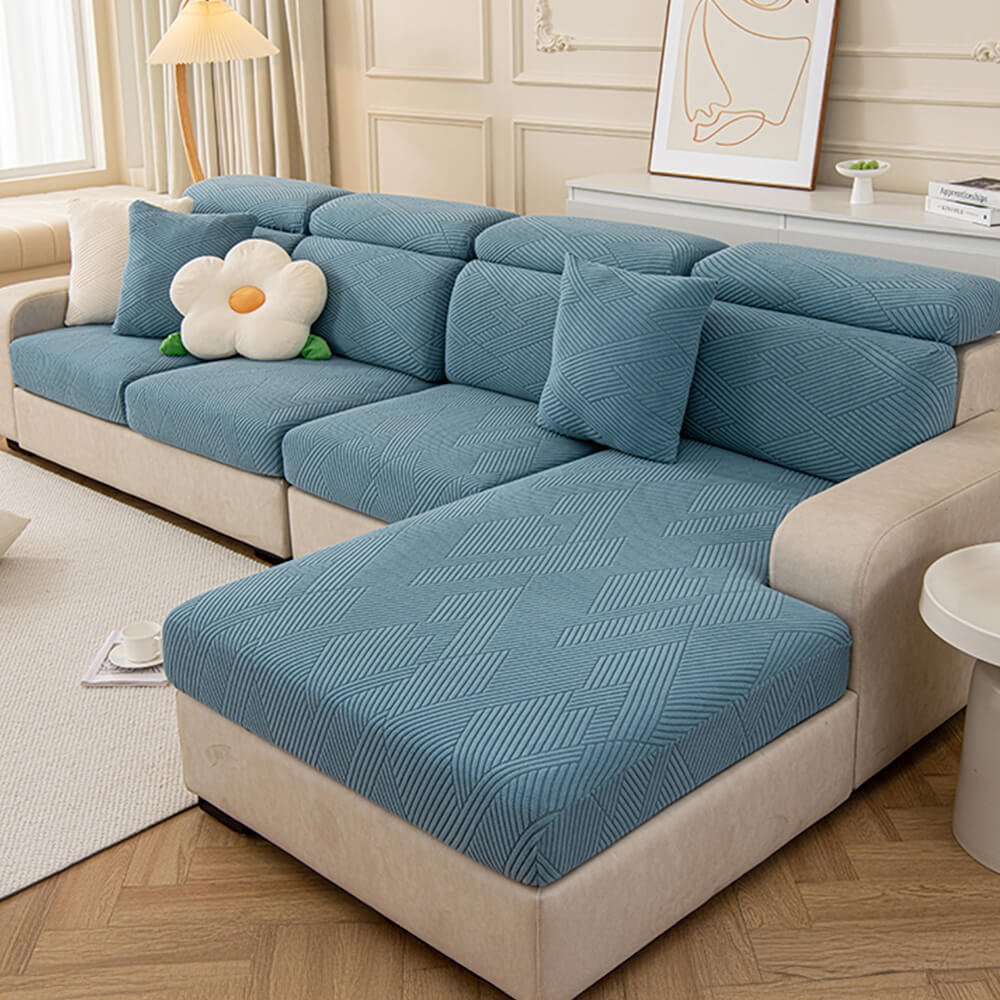 Housse de canapé magique stretch pleine largeur motif géométrique moderne