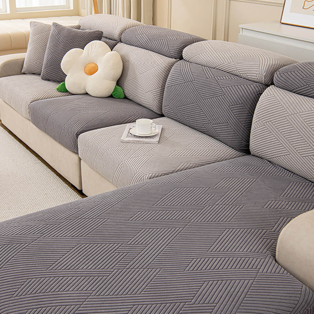 Housse de canapé magique stretch pleine largeur motif géométrique moderne