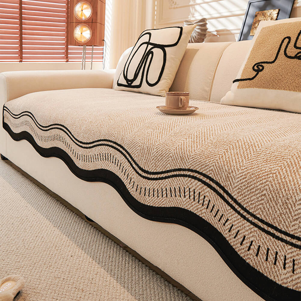Housse de canapé en chenille à chevrons antidérapante avec bords ondulés