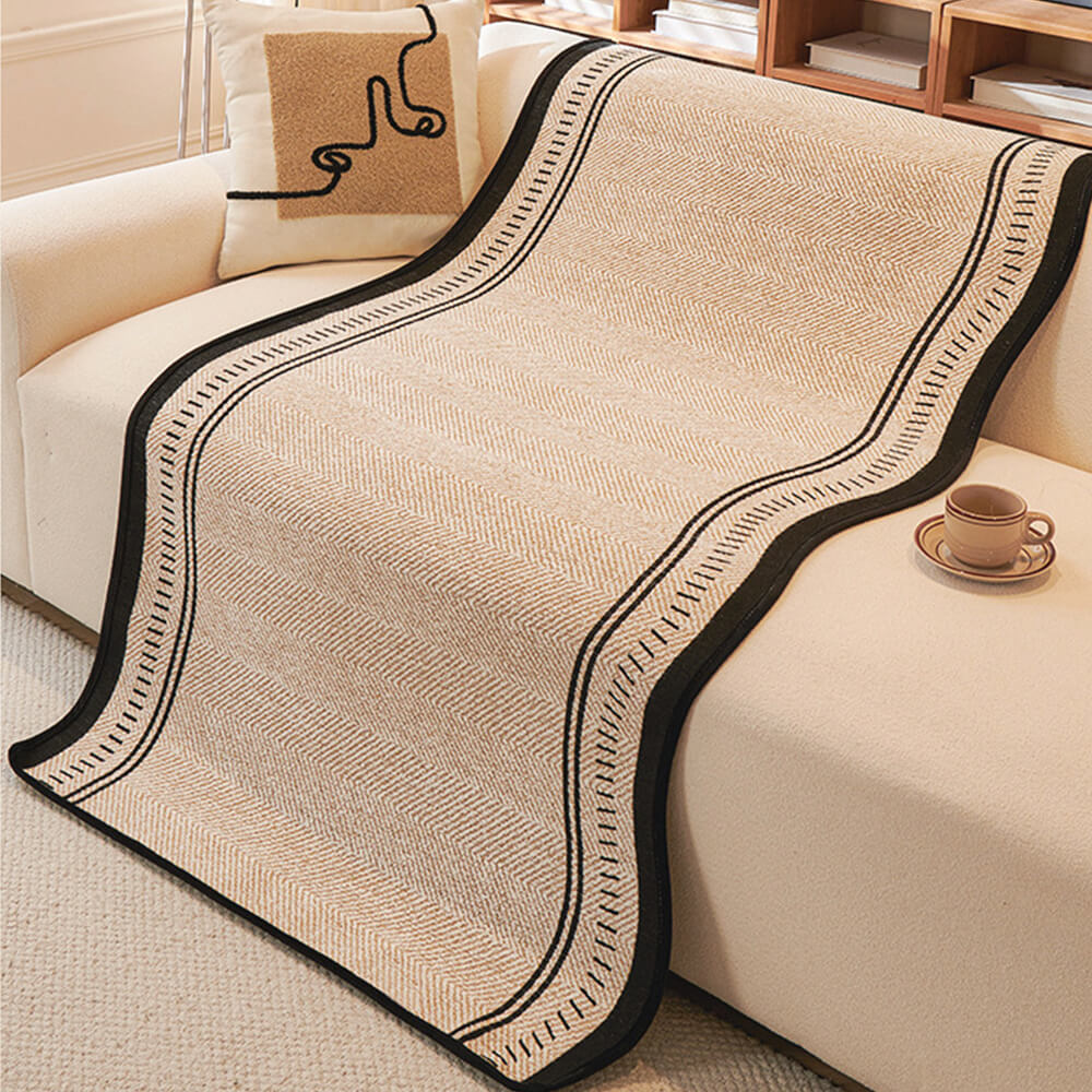 Housse de canapé en chenille à chevrons antidérapante avec bords ondulés