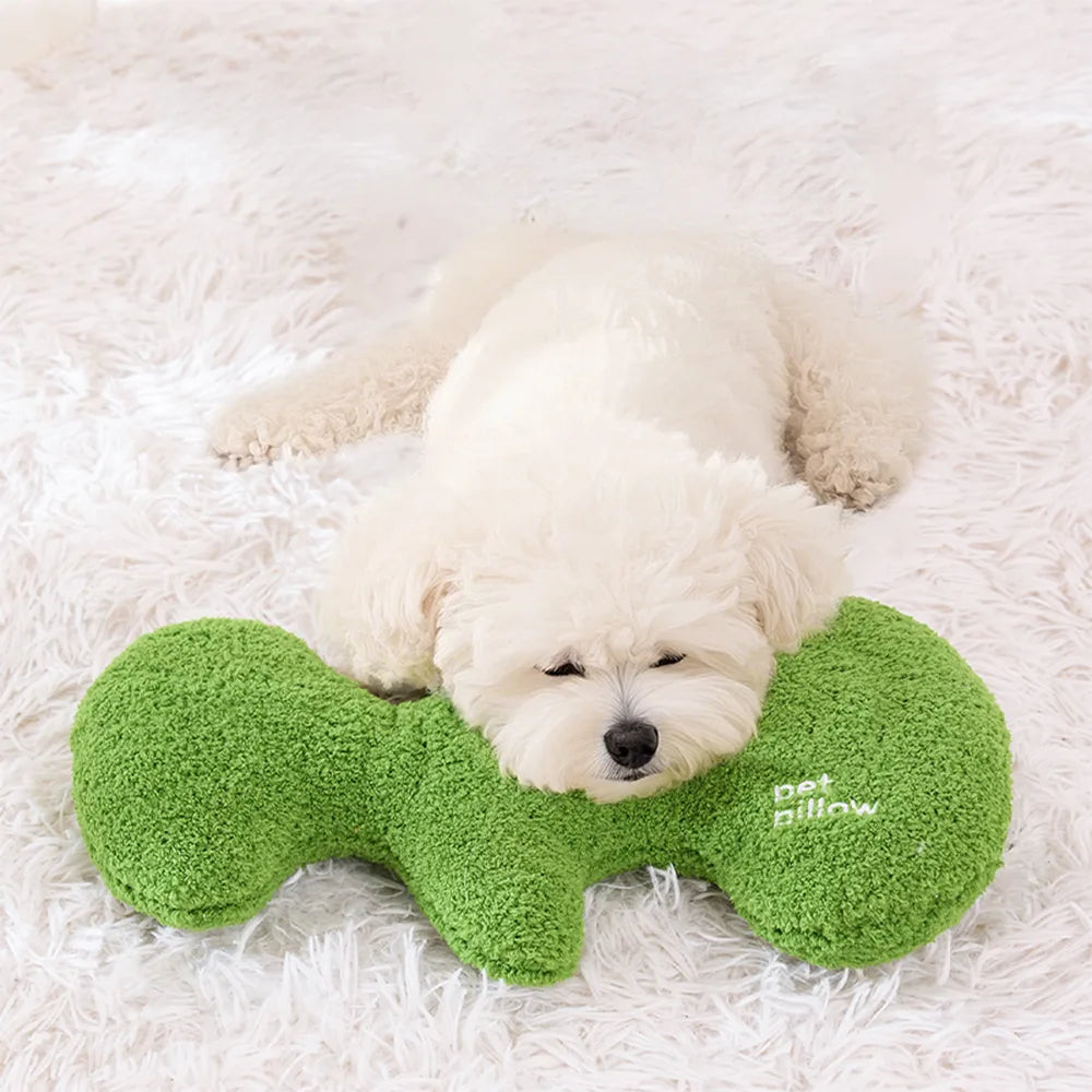 Coussin jouet pour chien en forme d’os avec couineur