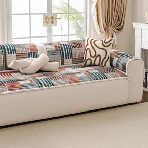 Housse canapé confortable avec lignes artistiques et matelassage, protection antidérapante.