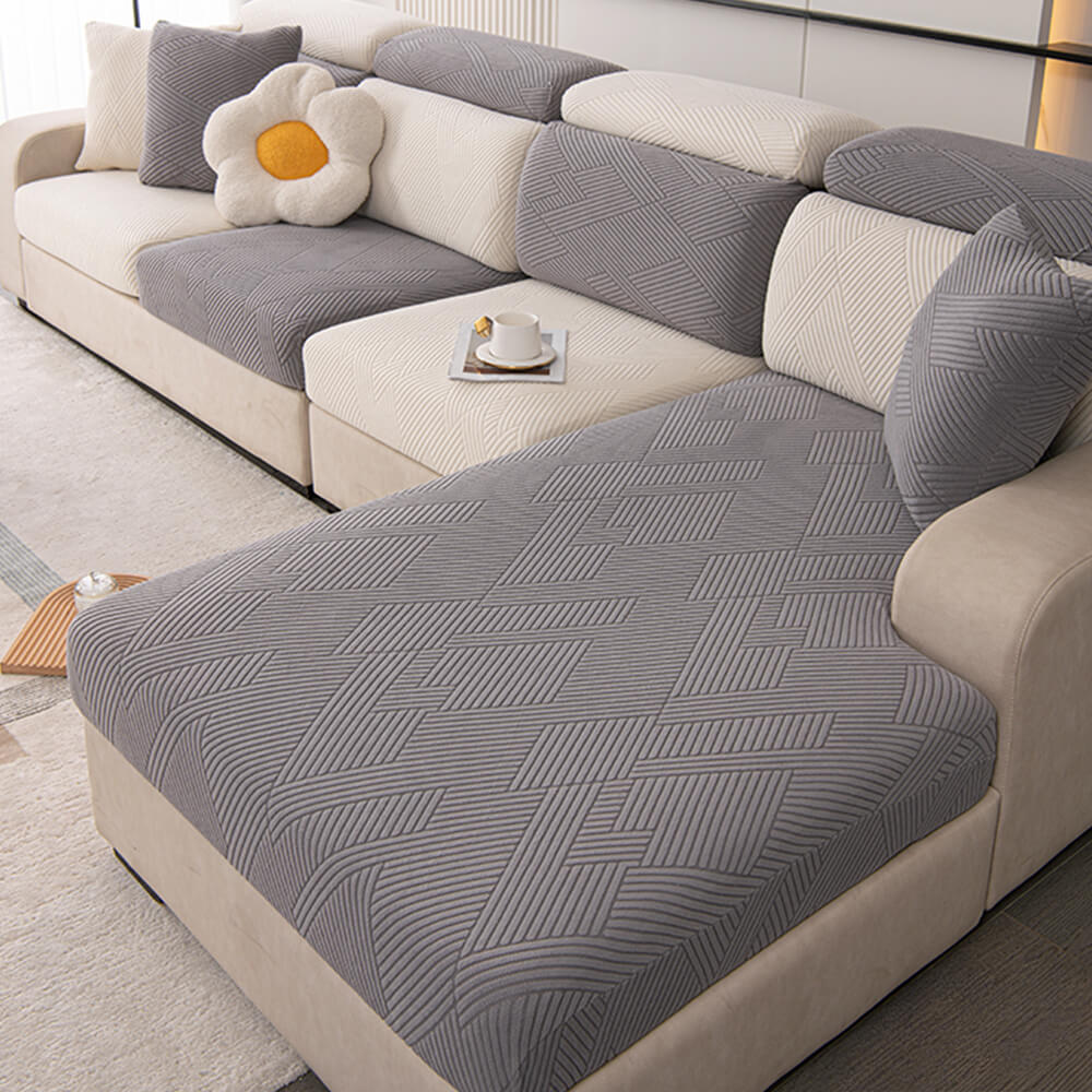Housse de canapé magique stretch pleine largeur motif géométrique moderne