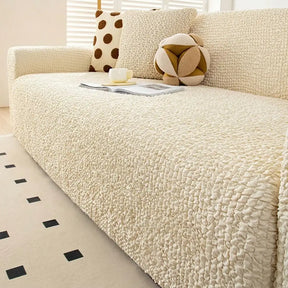 Housse de canapé extensible magique en seersucker et respirant, style crème, à couverture complète.
