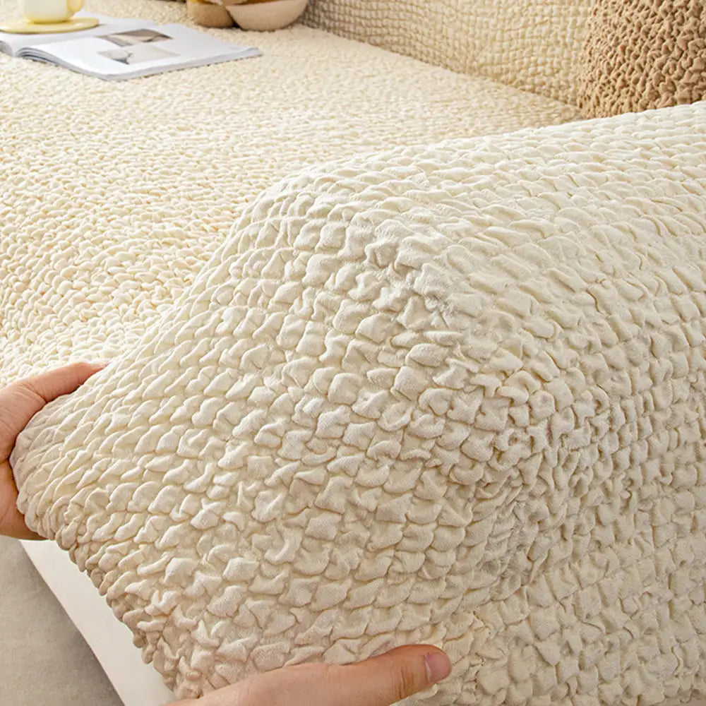 Housse de canapé extensible magique en seersucker et respirant, style crème, à couverture complète.