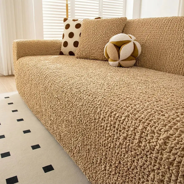 Housse de canapé extensible magique en seersucker et respirant, style crème, à couverture complète.