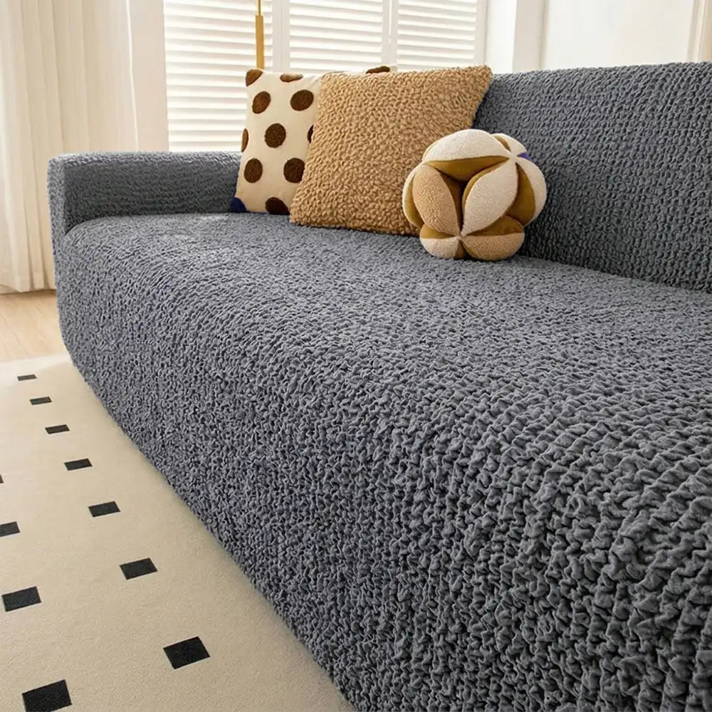 Housse de canapé extensible magique en seersucker et respirant, style crème, à couverture complète.