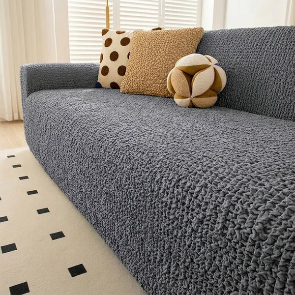 Housse de canapé extensible magique en seersucker et respirant, style crème, à couverture complète.