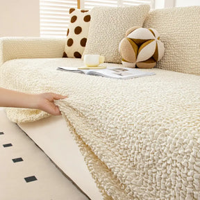 Housse de canapé extensible magique en seersucker et respirant, style crème, à couverture complète.