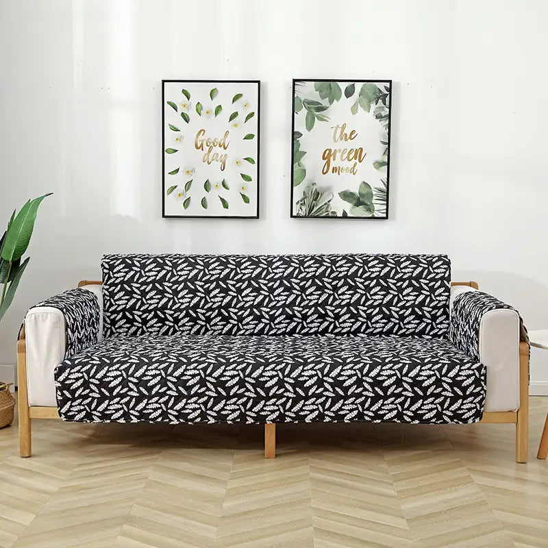 Housse de canapé matelassée une pièce avec motif feuilles et sangles élastiques antidérapantes