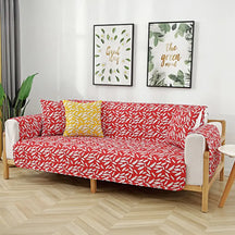 Housse de canapé matelassée une pièce avec motif feuilles et sangles élastiques antidérapantes