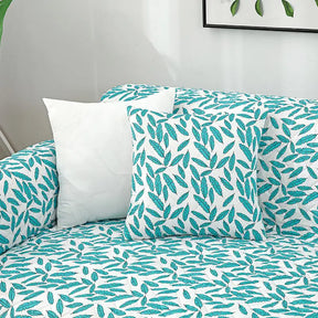 Housse de canapé matelassée une pièce avec motif feuilles et sangles élastiques antidérapantes