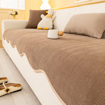 Housse canapé chenille chevrons minimaliste antidérapante bords ondulés