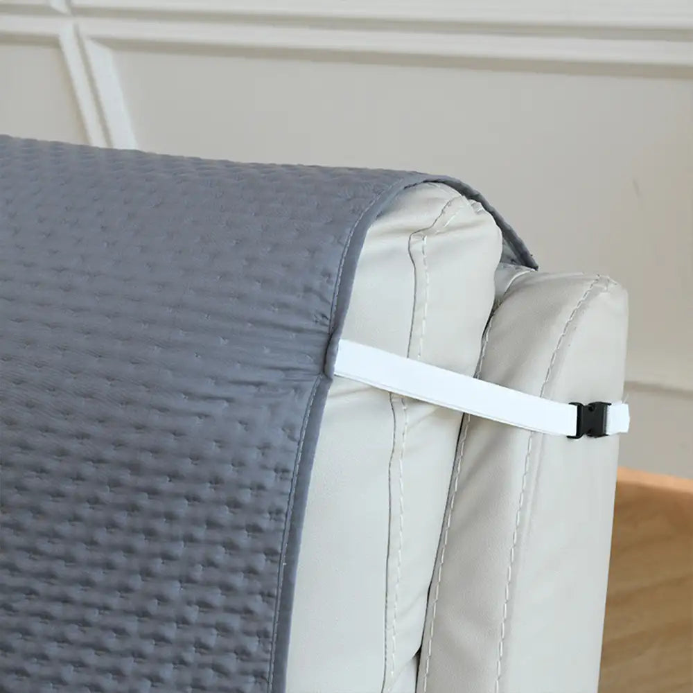 Housse de canapé en une pièce de couleur unie, imperméable, avec des sangles élastiques