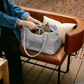 Sac de transport pour animaux en cuir synthétique respirant et portable, adapté pour les chiens et les chats, idéal pour les voyages et les vétérinaires.