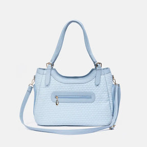 Sac de transport pour animaux en cuir synthétique respirant et portable, adapté pour les chiens et les chats, idéal pour les voyages et les vétérinaires.
