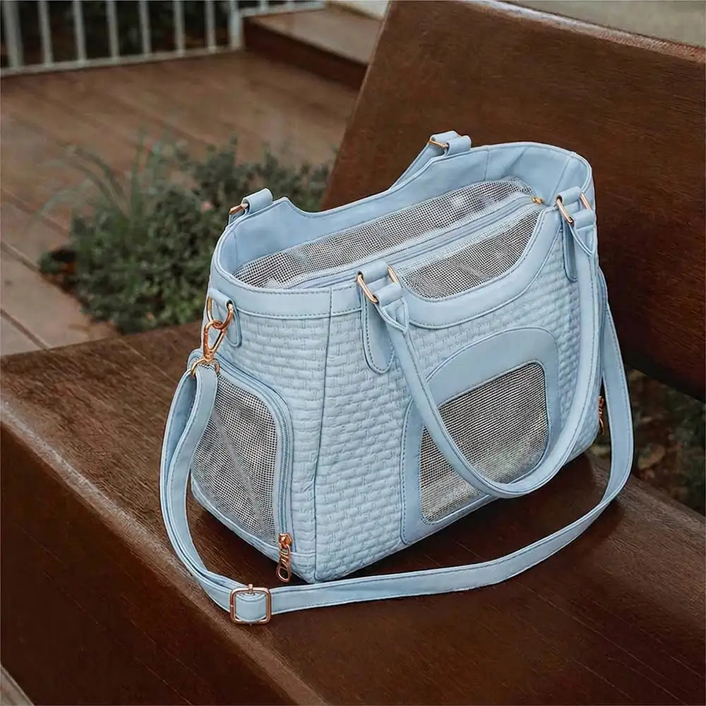 Sac de transport pour animaux en cuir synthétique respirant et portable, adapté pour les chiens et les chats, idéal pour les voyages et les vétérinaires.